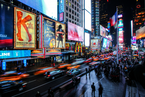 Photo by Florian Wehde shows the busy night light New York City's Broadway and Times Square area
