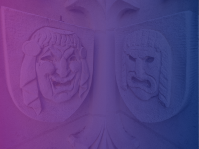 Two scultpures of masks with a colored gradient