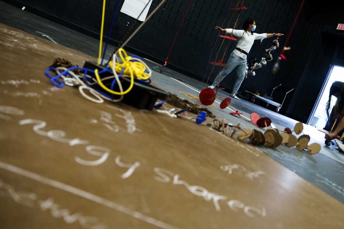 "Energy Shared" written in chalk on the floor where the build is taking place